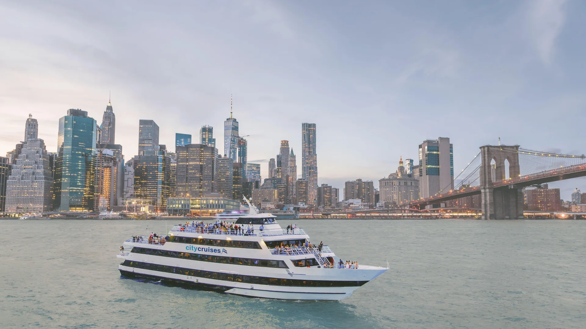 The Spirit of New York cruise boat on the harbor with the Manhattan skyline, from the buffet cruise listing